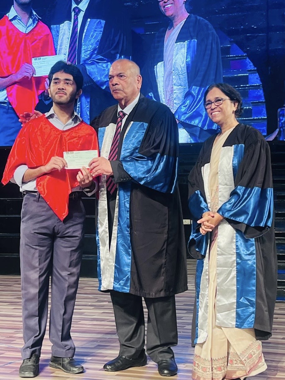 UnitDime creator at a school award ceremony